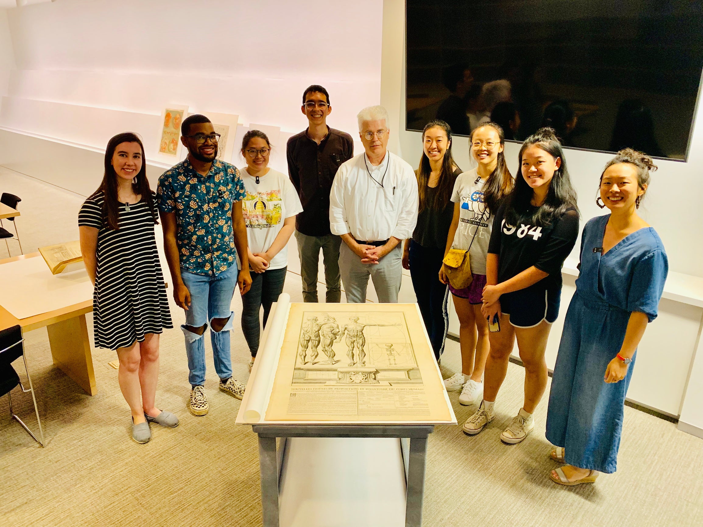 Image of Lan Li, an assistant professor of history and faculty member in the interdisciplinary Medical Humanities program at Rice, with her students and a curator at the Museum of Fine Arts, Houston