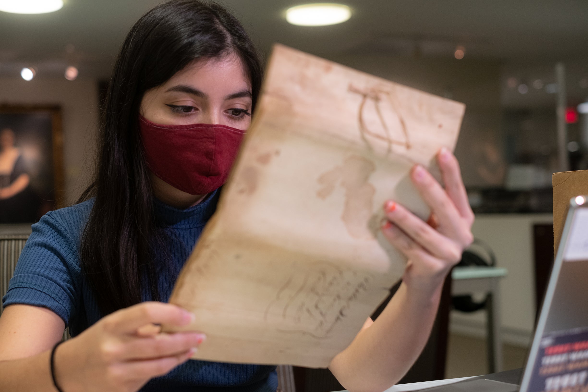 Katelyn Landry conducting archival research on the history of slavery and plantation life in Southeast Texas during the 19th century